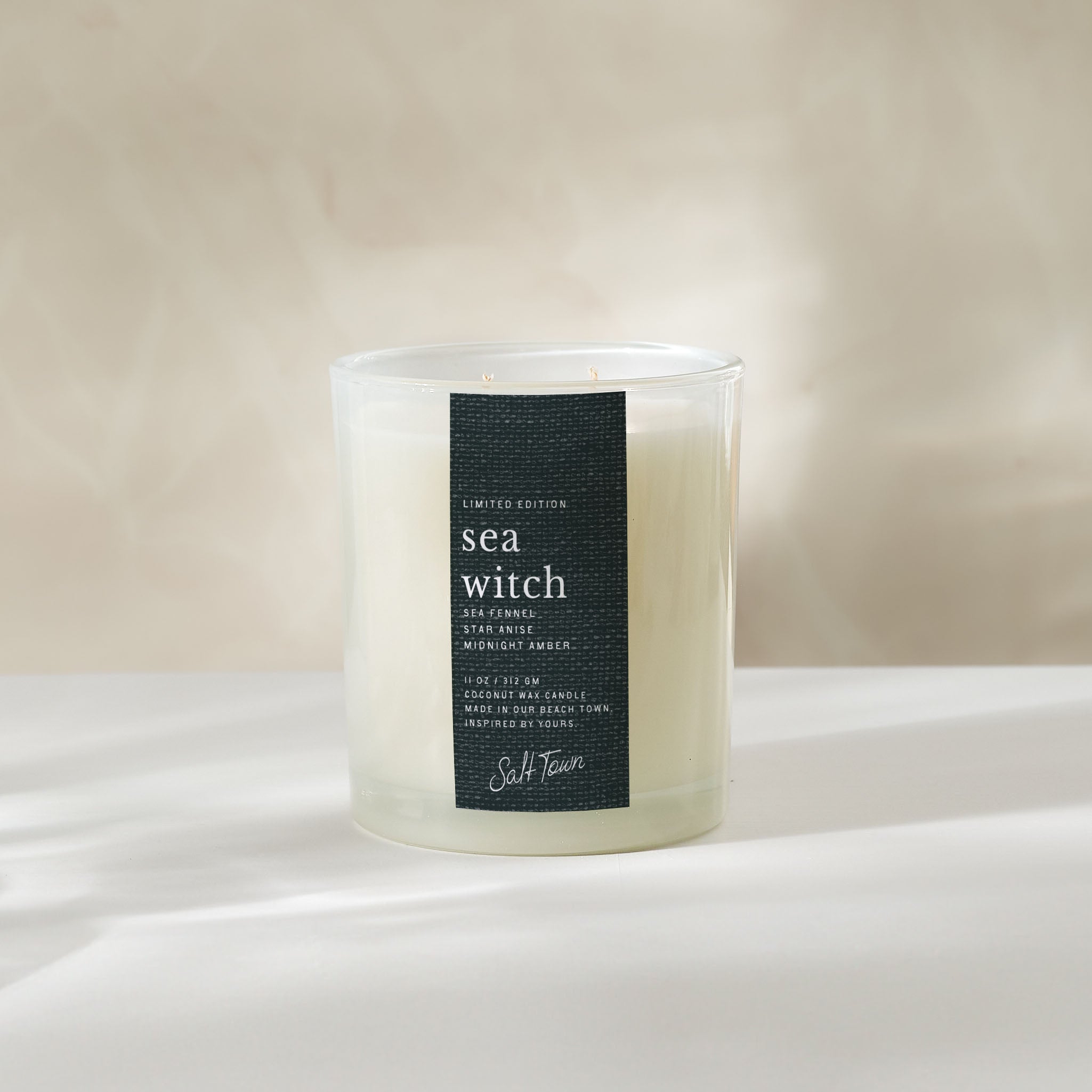 Candle labeled &