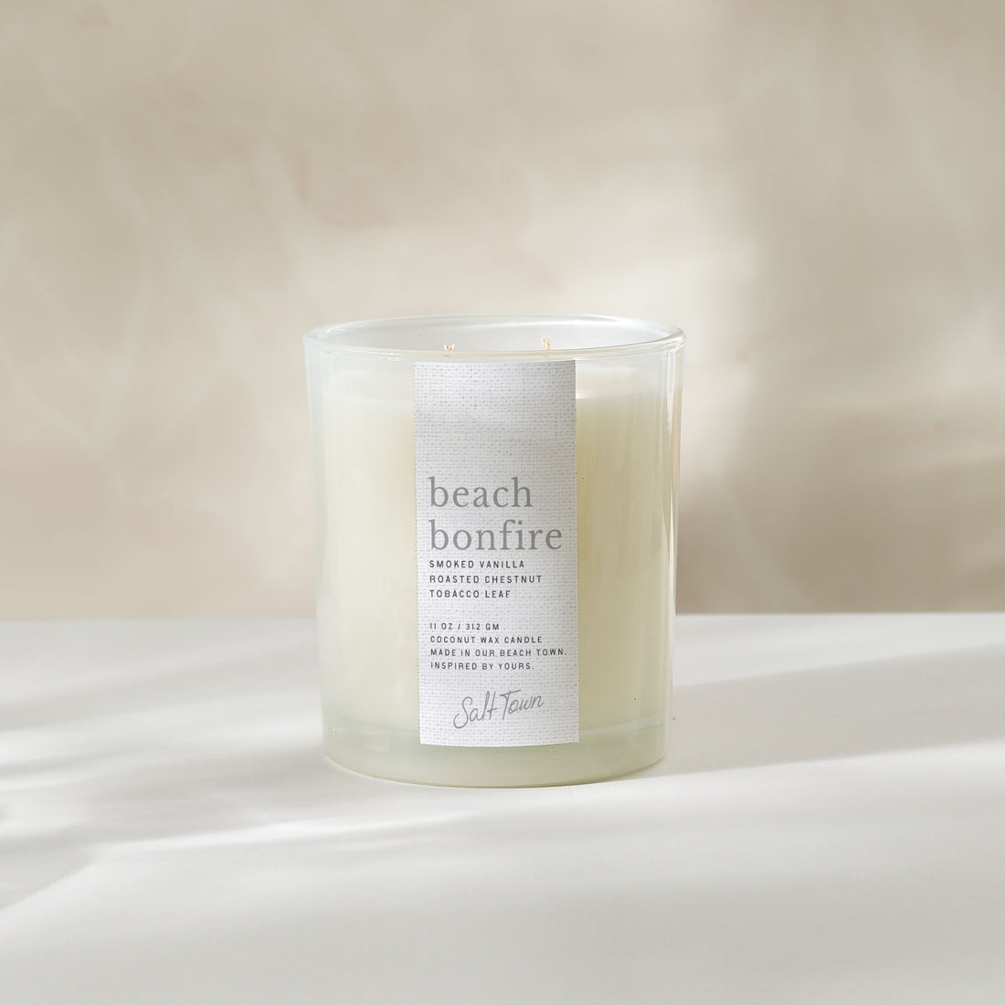 Candle labeled &
