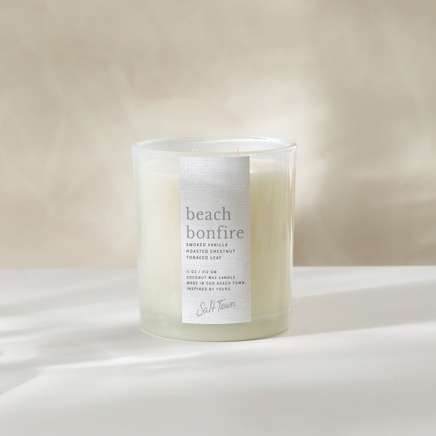 Candle labeled &