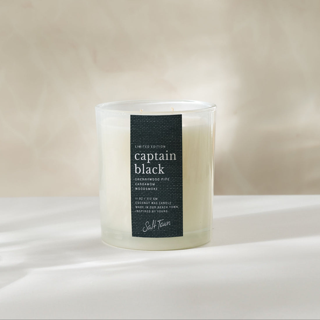 Candle labeled &