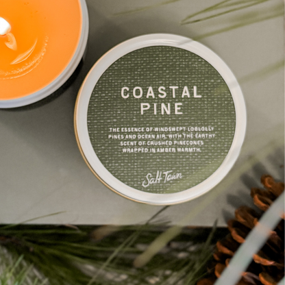 Coastal Pine candle label with green background and white text, surrounded by natural elements.