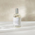 Room and linen spray bottle labeled &