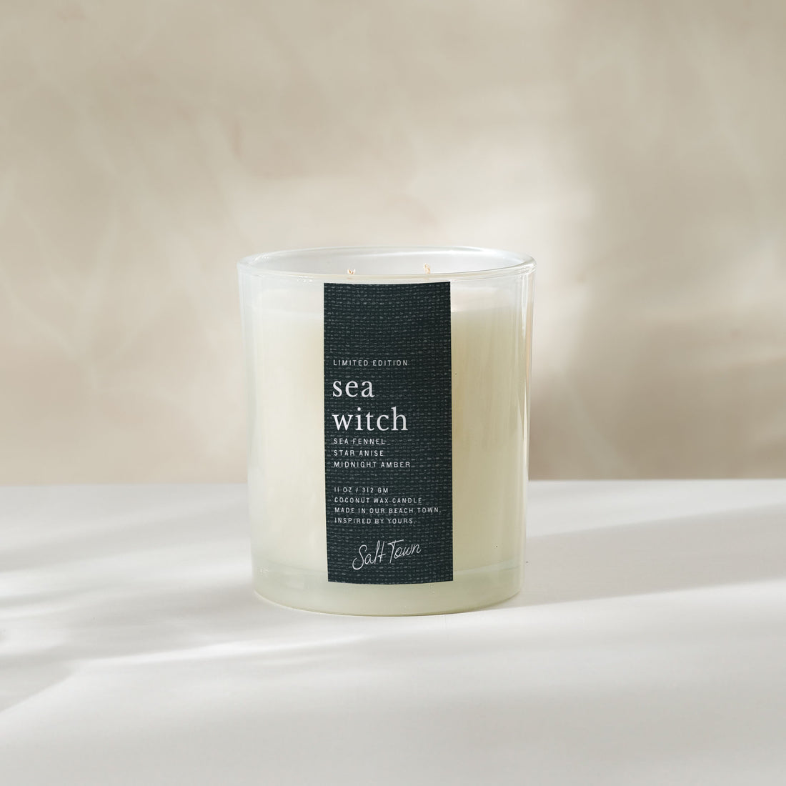 Candle labeled &
