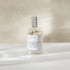 Room and linen spray bottle labeled &
